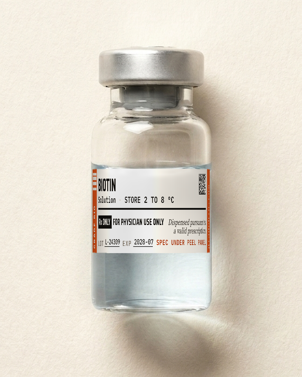 Biotin, clear solution in a sealed vial.